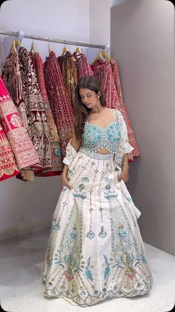 Ivory lehenga with aqua floral embroidery and matching blouse