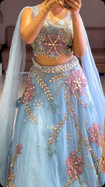 Sky-blue net lehenga with pink threadwork